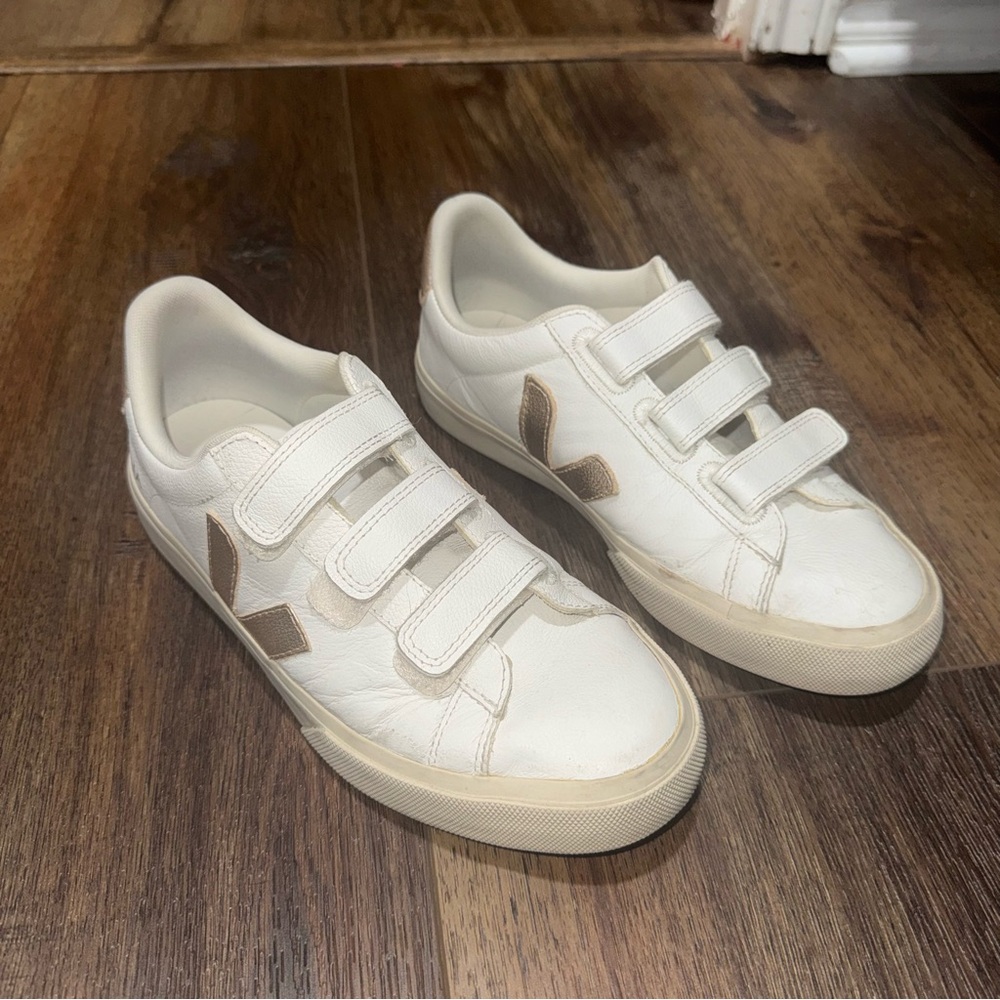 Veja white and gold leather sneakers